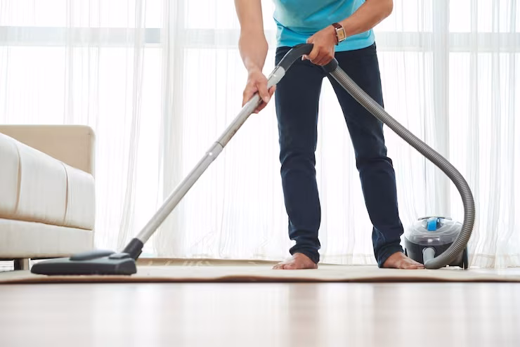 imgi_17_lower-body-shot-unrecognizable-man-vacuuming-carpet-home_1098-17133 Professional Pet Stain Removal in Bradenton Florida